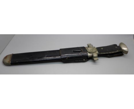A German WWII period saw blade knife/dagger, with scabbard, the leather stamped Carl-Busse 1940 