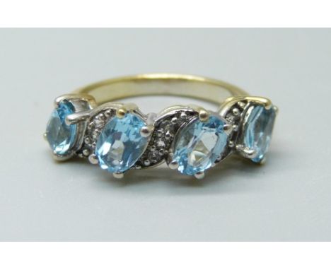 A silver gilt, aquamarine and zircon ring, L/M 
