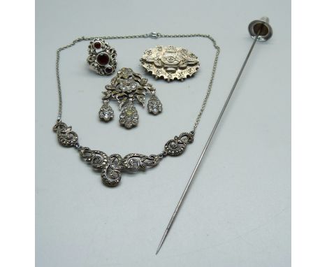 A hallmarked silver hat pin by Charles Horner, (dented), a hallmarked Victorian silver brooch, a paste set brooch, a marcasit