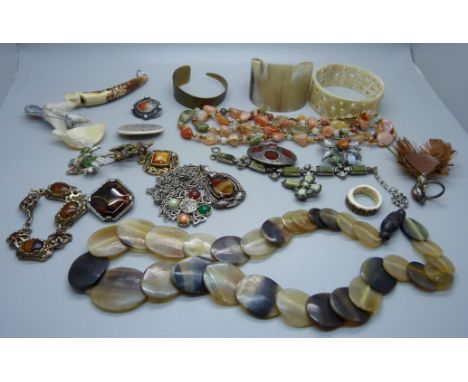A collection of Celtic jewellery including horn and a whistle pendant carved from an antler 
