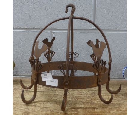 A vintage French metal meat hanger with cockerel detail 