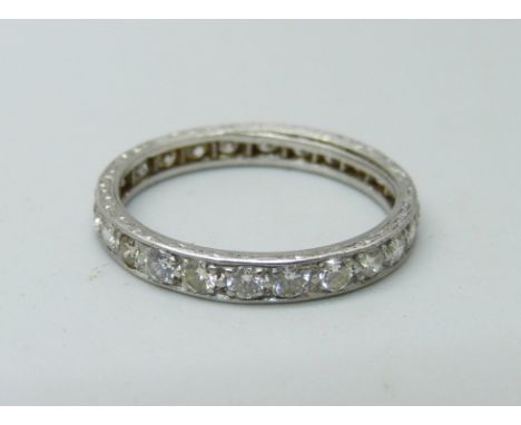 A white metal diamond eternity ring, 2.6g, O/P, set with 24 diamonds, approximately 1 carat diamond weight 