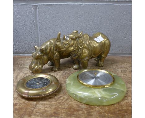A brass model hippopotamus and a rhinoceros, a barometer and a compass 
