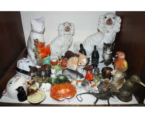 SECTION 4.  A good quantity of ceramic animal figures including Staffordshire spaniels, fairings, Wade etc