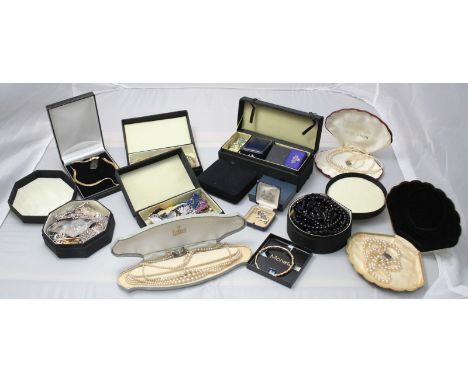 A good quantity of assorted costume jewellery including a silver-gilt 'Mother' brooch, belt buckles, beads, pieces by Charles