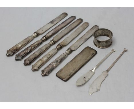 An engine-turned silver-mounted comb, together with silver butter knives and napkin ring