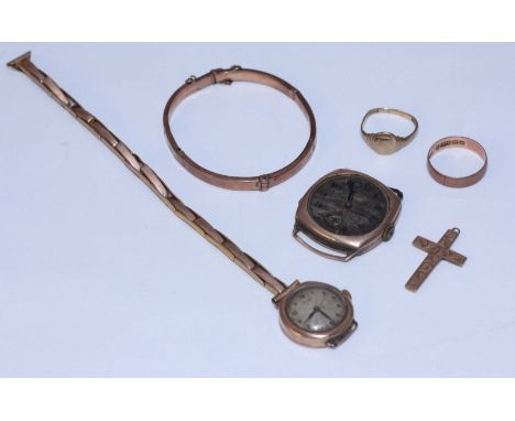 A small collection of 9ct gold jewellery items including two various watches (both AF) a small hinged bangle, two rings and a