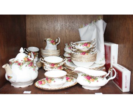 SECTION 49. A 57-piece Royal Albert 'Old Country Roses' pattern tea and dinner service comprising of a teapot, cups, saucers 