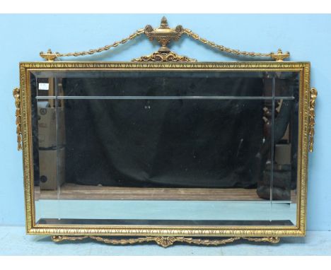 A rectangular Adams style gilt mirror, with vase finial and bell flower decoration. 76 x 98cm including finial.