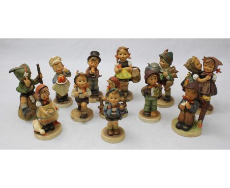 A collection of twelve assorted Goebel ceramic figures.