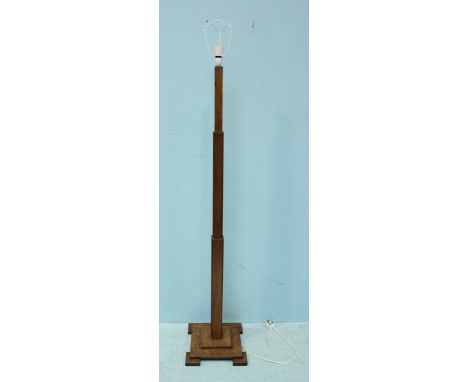 An Art Deco wooden lamp stand with stepped square base, approximately 150cm high