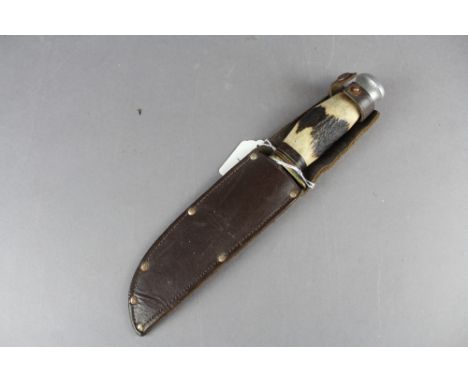 A William Rodgers "Cut my way" knife. Having horn handle and held within leather scabbard