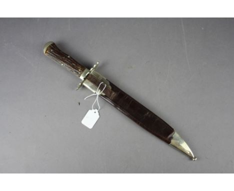 A Quality 19th Century Rodgers & Sons Bowie knife having antler handles and silver plated mounts. The 23cm clip point blade m