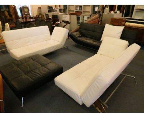 Ligne Roset Smala white leather pair of sofas on chrome legs with a matching black leather Smala sofa and stool