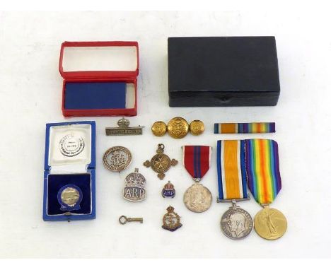 Militaria:- A mixed group of badges and medals comprising:-British War Medal and Victory Medal both with ribbons, to 89571 Pr