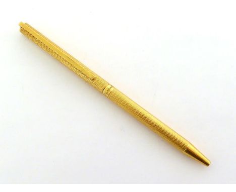 Dupont, a rolled gold ballpoint pen, of engine turned design CONDITION:  in working order 