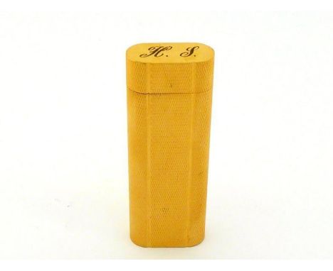 Cartier, Paris, a gold plated lighter, of oval section, engine turned design, numbered 42213E, engraved to the cover with ini