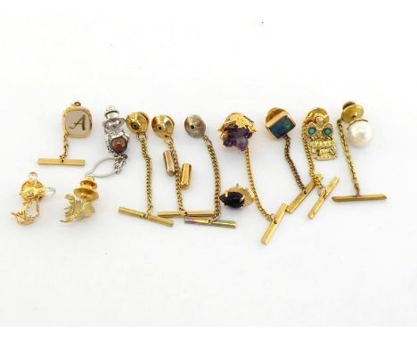 A mixed lot of yellow metal dress studs, (testing 14 carat gold), examples including amethyst, South Sea cultured pearl, synt