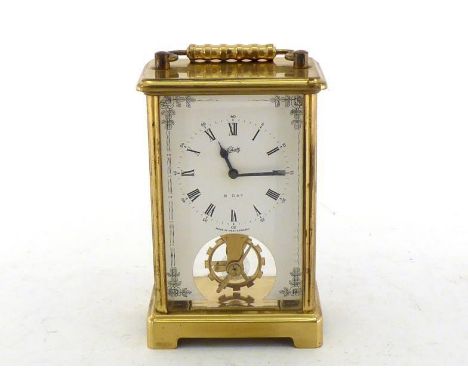 A German brass carriage clock with desirable eight day movement and fixed key, the balance wheel visible from the front below