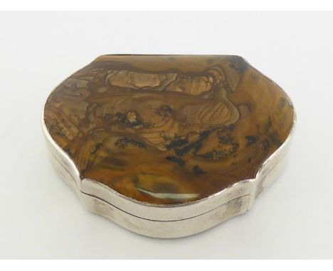 A silver snuff box  of cartouche form with brown agate cover and base, unmarked, probably early 19th century, gilt interior t