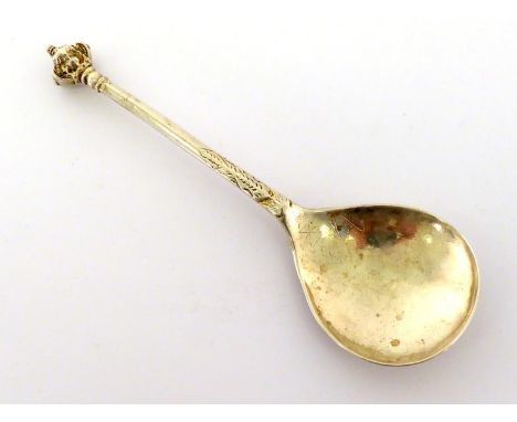 A Scandinavian parcel-gilt silver spoon with large cherub mask finial, marked indistinctly at base of stem below a tiny later