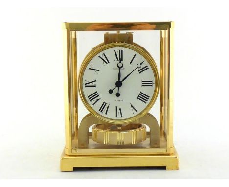 A four light Jaeger le Coultre Atmos clock in gilt frame, number 350139, together with its matching wall bracket. CR. Not wor