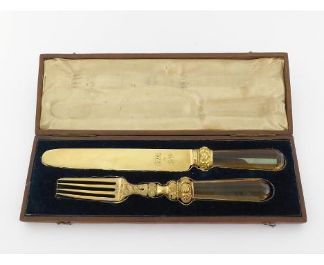 A fine George III silver gilt christening knife and fork with faceted citrine handles, by Eley & Fearn, London, 1816 and 1818