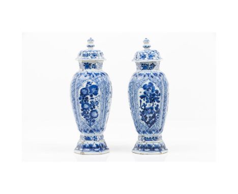A pair of Kangxi vases  with coversChinese porcelainWith moulded and under glaze blue decoration depicting diaper pattern and