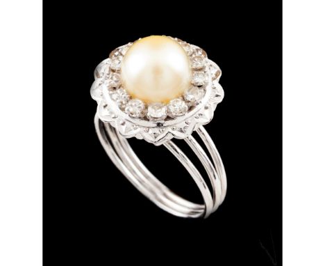 A ringPlatinumTriple band and stylised flower set with one cultured pearl (ca. 7 mm) and small 8/8 cut diamondsPortugal, ca. 