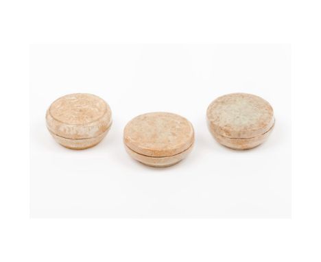 Three Qingbai boxes and coversCeladon glaze ceramic of floral reliefs decorationSong dynasty (960-1279)Diam.: 7 cm (3)