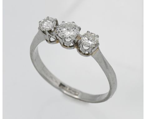 A platinum three stone graduated diamond ring, Size Q