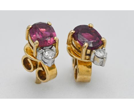 A pair of 18ct ruby and diamond earrings.