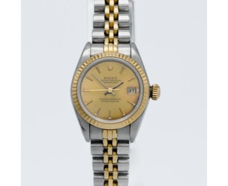 Rolex, a ladies steel and gold Datejust Chronometer with jubilee bracelet, champagne baton dial. Model number 69173, Case num