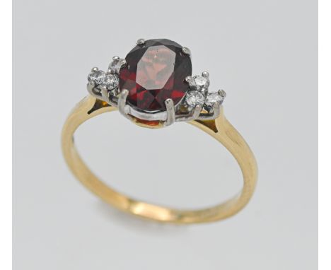 An 18ct diamond and garnet cluster ring. Size Q.