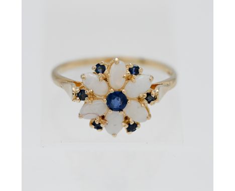 An opal and sapphire cluster ring. Size U.