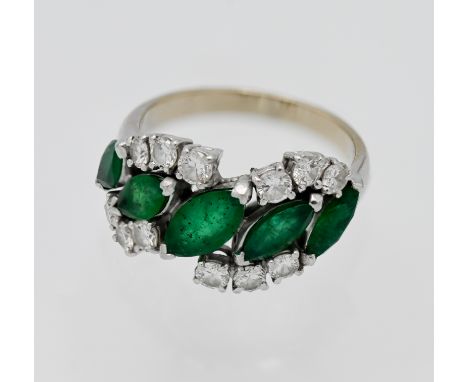 An impressive five stone emerald and diamond abstract ring, white gold set (no hallmark), 5 x marquise cut graduated emeralds