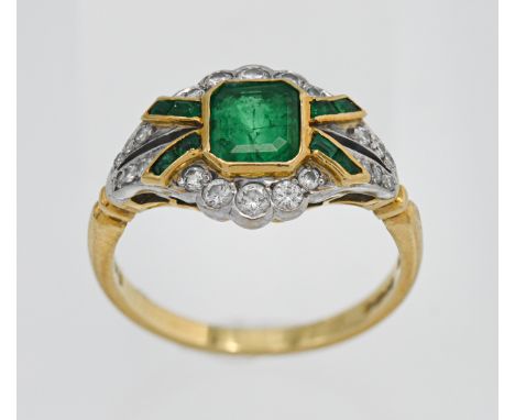 An emerald and diamond ring set in 18ct yellow gold with centre emerald (6mm x 5.5mm) with cut corners with 4 rows of emerald