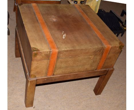 Modern designer side table with drawer, modelled as a leather travelling trunk on stand, 66cm wide