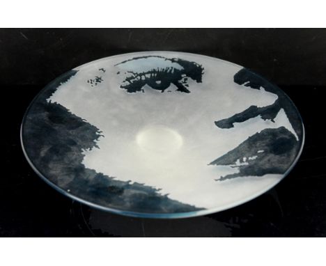 Luana Adriani (fl.1975-2007), portrait glass dish sandblasted with the image of a female face on blue glass, signed, 30cm dia