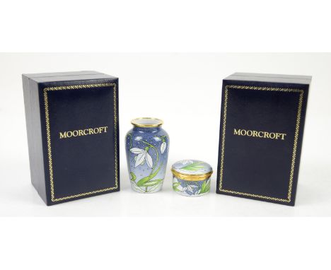 Moorcroft Snowdrop pattern enamel vase, decorated with snowdrops on a mottled blue ground, designed by Rachel Bishop, Moorcro