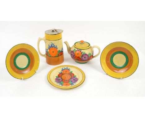 Clarice Cliff Gayday pattern, globe teapot for one, h11cm, stand, jug, h15cm, and two saucers with green, brown and yellow ba