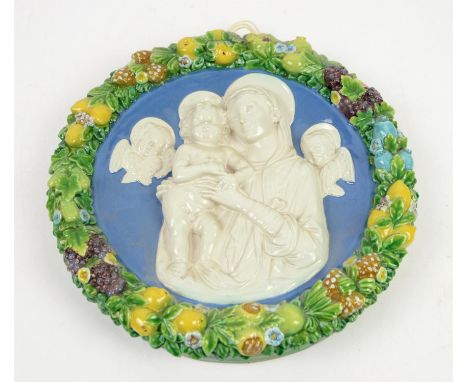 Cantagalli round plaque, in the manner of Della Robbia, depicting the Virgin Mary and Jesus flanked by angels in white glaze 