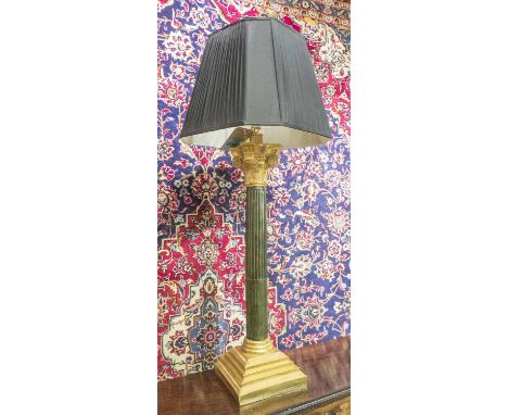 LARGE TABLE LAMP OF CLASSICAL COLUMN FORM, ebonised and gilt wood, with shade, 107cm H overall.