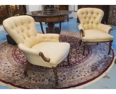 ARMCHAIRS, a pair, Victorian walnut, circa 1860, in pale buttoned yellow fabric, on ceramic castors, 76cm H x 63cm W. (2)
