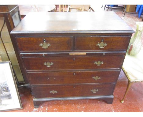 An oak chest with two short and three long drawers on bracket feet 106cm high, 102cm wide 