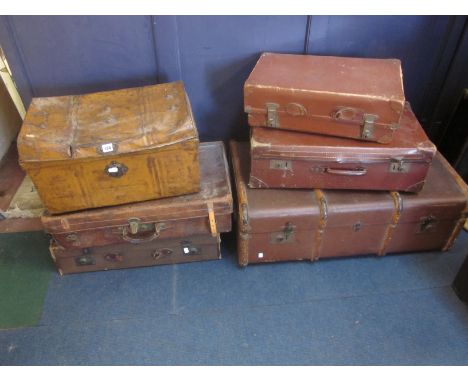 A group of vintage luggage to include a trunk and three leather suitcases and a painted tin trunk 