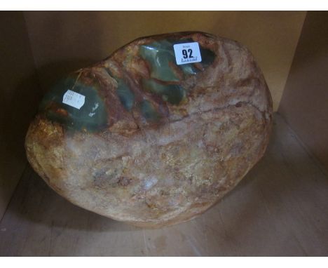 A large rough Jade boulder, 29cm high