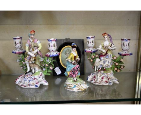 A pair of Continental figural candlesticks, 15cm high, a continental figure of a lady, 12.5cm high and a painted portrait min