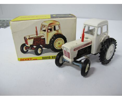 A Boxed Original Dinky #305 David Brown 990 Tractor, white cab, hubs, cowl, red exhaust. Model very good, no visible chips, b