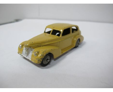 An Original Dinky #39B Oldsmobile Six Sedan, light brown body, post war ridged fawn hubs, silver detailing, black base plate 